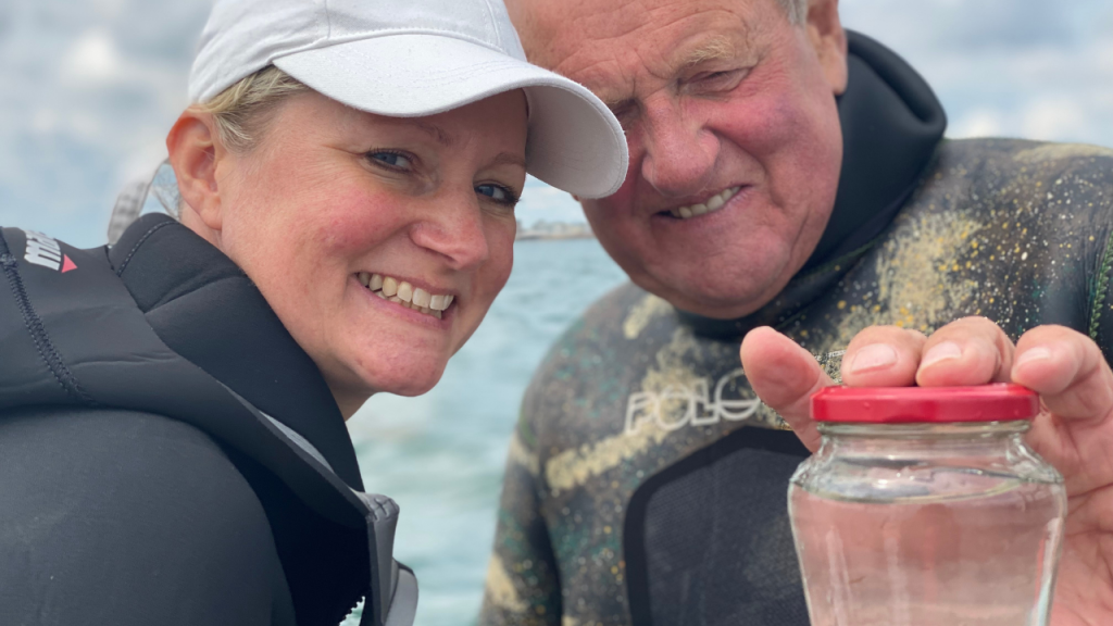 Eric and Catrine help experts release cuttle fish back into the water